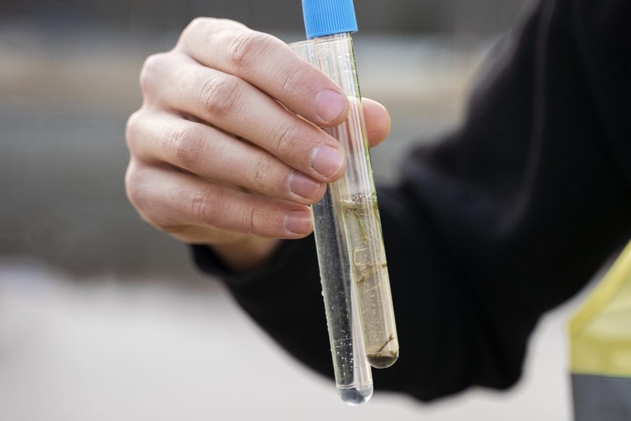 hand-holding-water-samples-from-river